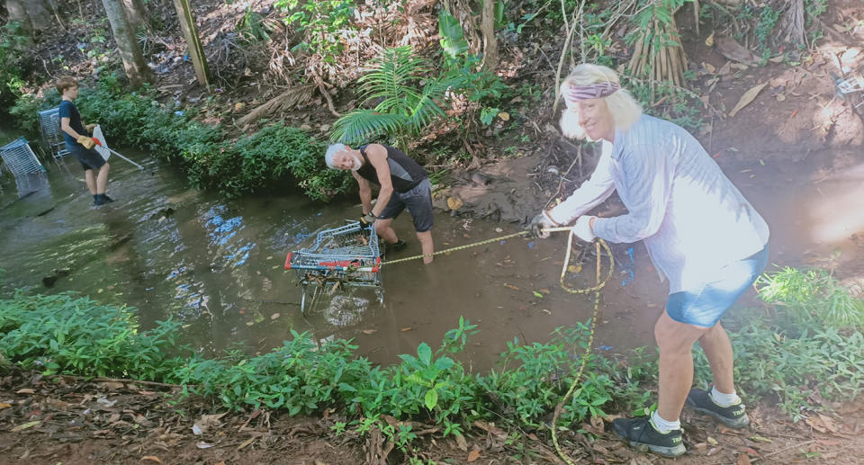 The volunteers pulled the Woolworths trollies out of the creek.