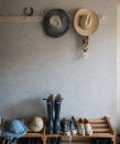 <p> On the ground floor of your home you may have several smaller rooms, such as boot rooms, mudrooms and utility rooms. As well as being on the petite side, these areas are often working spaces which don&#x2019;t tend to see a lot of decorating love. Add some TLC to these spaces through your wallpaper. </p> <p> In terms of which patterns to look for, Joa Studholme, Color Curator at Farrow &amp; Ball, advises that you should look at using &#x2018;wallpaper which some might feel would overwhelm in a larger space. Patterns like this (Tourbillon by Farrow &amp; Ball) which are bursting with joyful movement feel calmer when the pattern and ground are close in colour and just serve to make the walls feel less flat and hard.&#x2019; </p> <p> The other consideration when decorating a mudroom, or any other busy, working area of the home, is how to take care of it.&#xA0; </p> <p> &#x2018;To protect wallpaper from the high traffic it is a good idea to use some panelling on the lower half of the room, which should be painted in the darker tone of the wallpaper,&#x2019; suggests Joa.&#xA0; </p> <p> &#x2018;Alternatively, a dado rail can be used, with the wall below it again painted in the darkest tone of the wallpaper in our washable Modern Emulsion. Strongly colored wallpaper used on the interior of cupboards or dressers also adds a fantastic extra element in these spaces and will be more protected.&#x2019; </p>