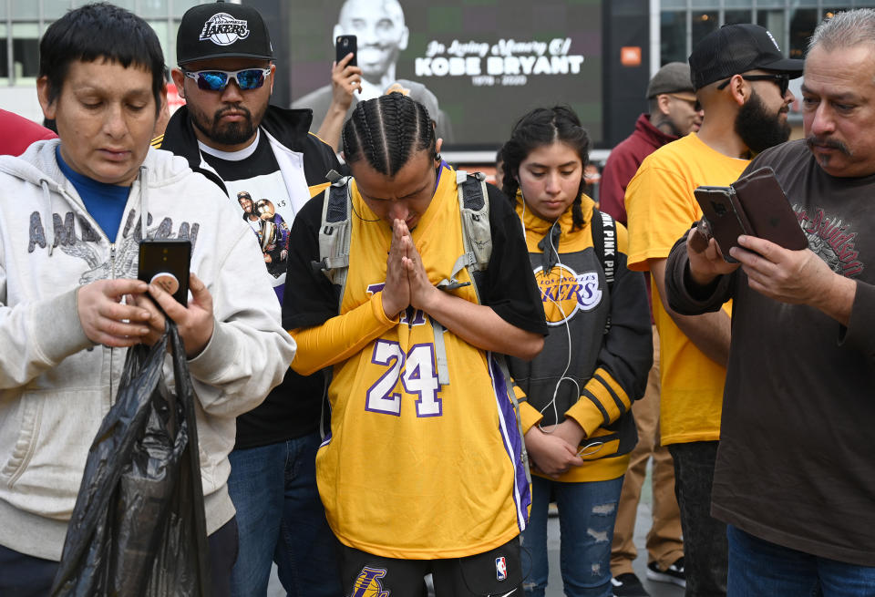 Jan 27, 2020; Los Angeles, California, USA; Fans gather at LA Live, across the street from Staples Center, to pay tribute to Kobe Bryant who was killed in a helicopter crash Jan 26, 2020. Mandatory Credit: Jayne Kamin-Oncea-USA TODAY Sports