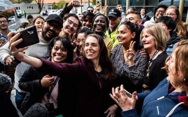 Ms Ardern was on the campaign trail with voters in Palmerston North - -/-