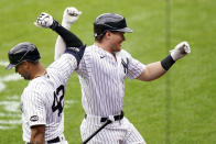 New York Yankees' Luke Voit, right, celebrates with Aaron Hicks after hitting a solo home run off New York Mets starting pitcher Robert Gsellman in the first inning of a baseball game, Saturday, Aug. 29, 2020, in New York. (AP Photo/John Minchillo)