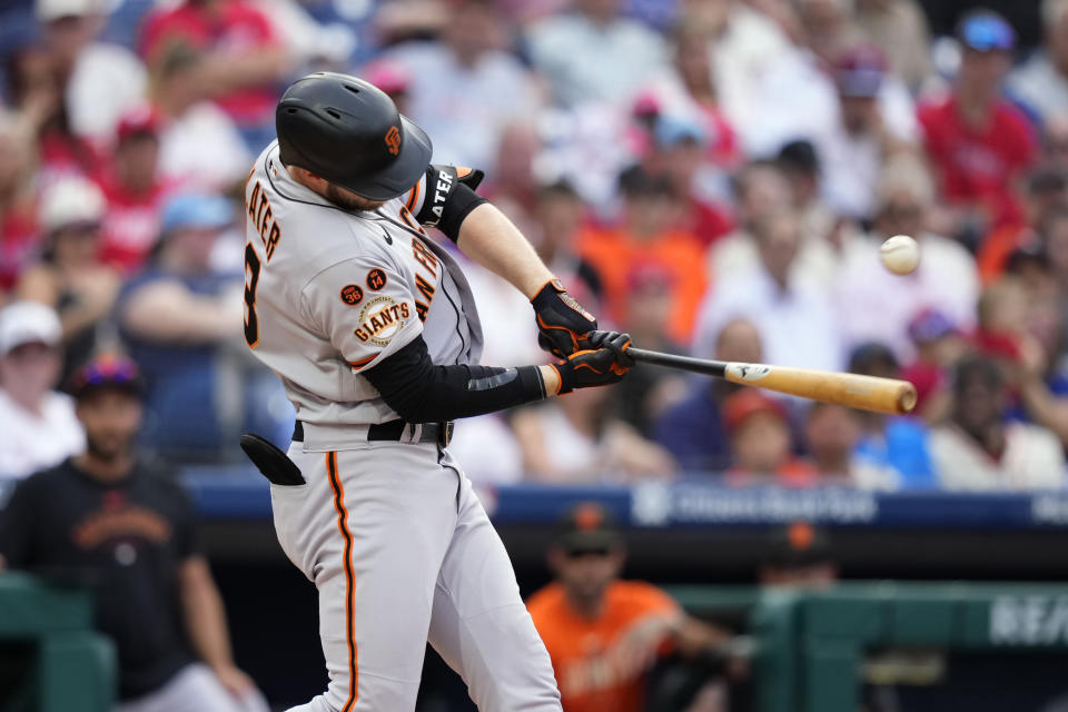 San Francisco Giants' Austin Slater hits a run-scoring double against Philadelphia Phillies pitcher Matt Strahm during the seventh inning of a baseball game, Wednesday, Aug. 23, 2023, in Philadelphia. (AP Photo/Matt Slocum)