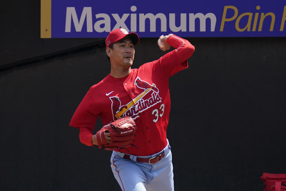 St. Louis Cardinals' Kwang-Hyun Kim works out in the bullpen before a baseball game against the Chicago White Sox Saturday, Aug. 15, 2020, in Chicago. (AP Photo/Charles Rex Arbogast)