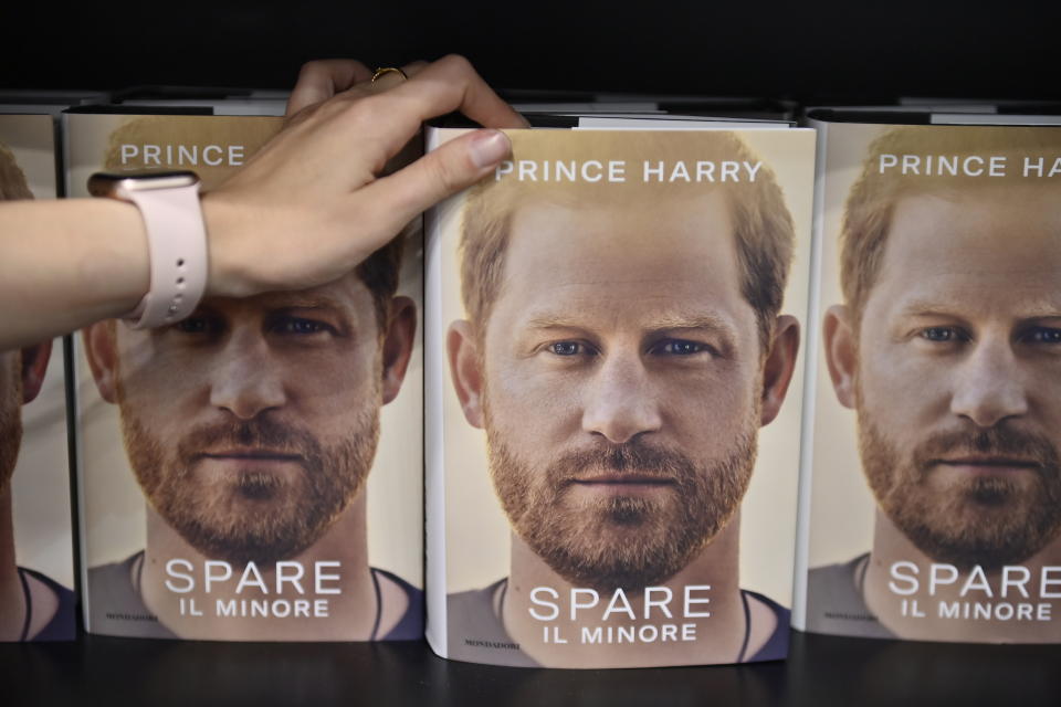 TURIN, ITALY - MAY 19: Hands holds the Prince Harry book Spare during the Turin Book Fair 2023 on May 19, 2023 in Turin, Italy. The Turin International Book Fair is the largest book fair in Italy and one of the most important in Europe, involving more than 1,400 exhibitors and attracting 150,000 visitors a year. (Photo by Stefano Guidi/Getty Images)