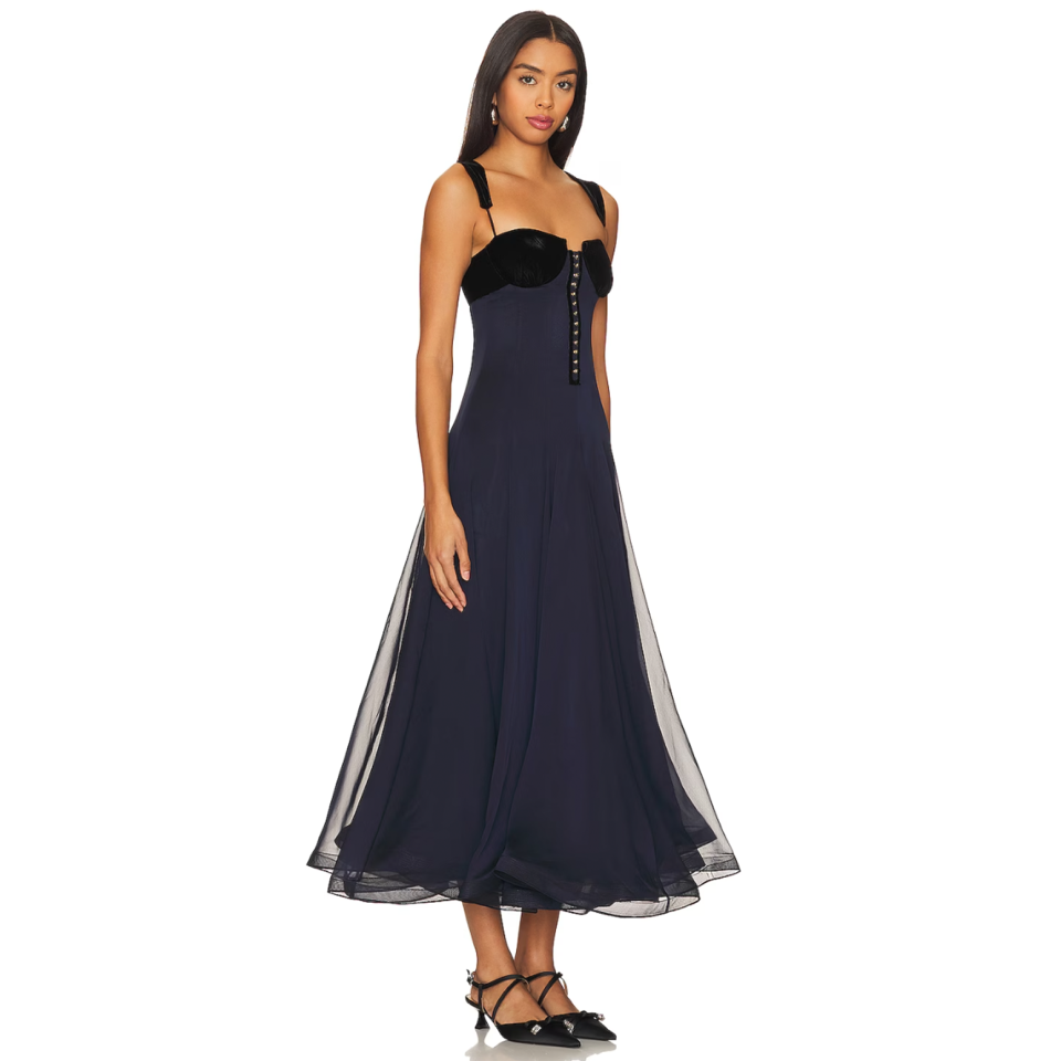 <p><a href="https://go.redirectingat.com?id=74968X1596630&url=https%3A%2F%2Fwww.revolve.com%2Fnafsika-skourti-urban-waltz-dress-in-navy-black%2Fdp%2FNAFR-WD9%2F%3Fd%3DWomens%26page%3D1%26lc%3D20%26itrownum%3D5%26itcurrpage%3D1%26itview%3D05&sref=https%3A%2F%2Fwww.womenshealthmag.com%2Frelationships%2Fg38439489%2Fbest-winter-wedding-guest-dresses%2F" rel="nofollow noopener" target="_blank" data-ylk="slk:Shop Now;elm:context_link;itc:0;sec:content-canvas" class="link ">Shop Now</a></p><p>Urban Waltz Dress</p><p>revolve.com</p><p>$1710.00</p>