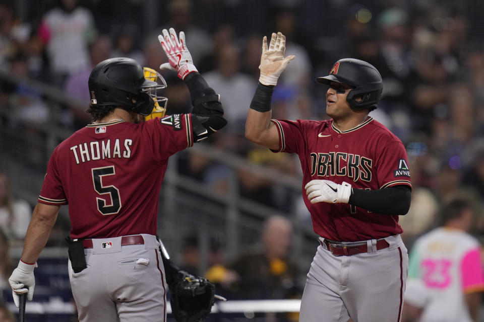 Arizona Diamondbacks' Gabriel Moreno, right, celebrates with teammate Alek Thomas after hitting a home run during the fifth inning of a baseball game against the San Diego Padres, Thursday, Aug. 17, 2023, in San Diego. (AP Photo/Gregory Bull)