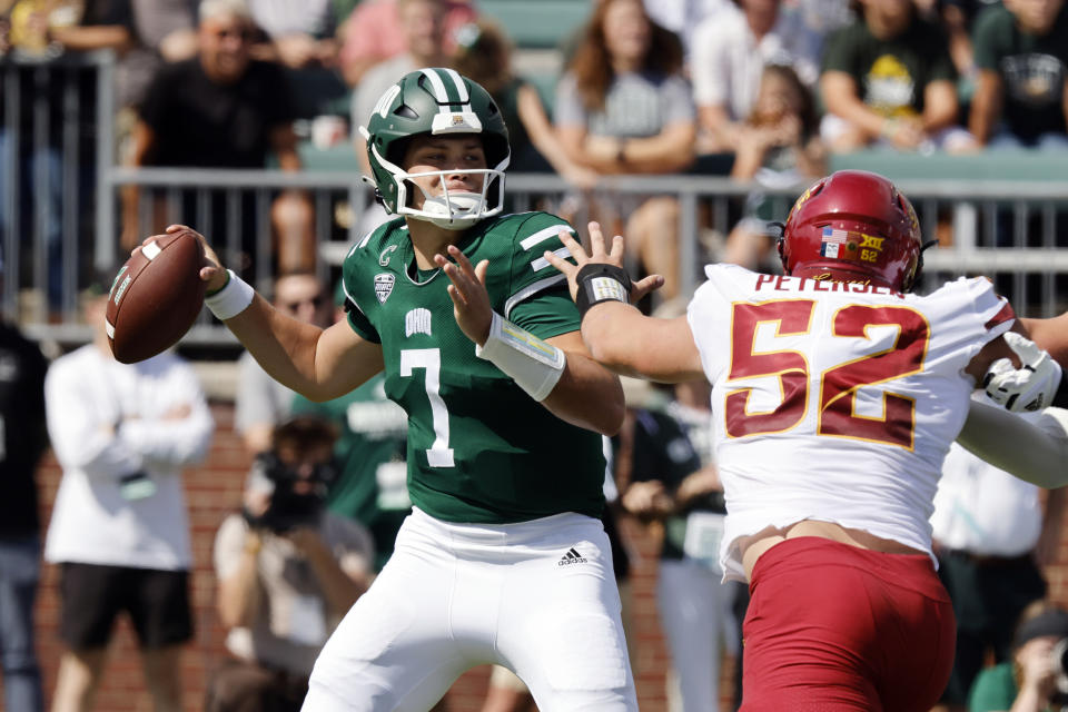 Ohio quarterback Kurtis Rourke, left, drops back to pass in front of Iowa State defensive end Joey Petersen during an NCAA college football game Saturday, Sept. 16, 2023 in Athens, Ohio. (AP Photo/Paul Vernon)