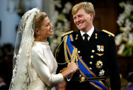 FILE PHOTO: Princess Maxima smiles broadly at Dutch Crown Prince Willem-Alexander during their wedding ceremony in the Nieuwe Kerk, or New Church, in Amsterdam, February 2, 2002. REUTERS/Jerry Lampen/File Photo