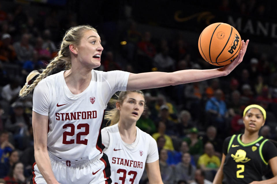 FILE - Stanford forward Cameron Brink (22) grabs a rebound against Oregon during the first half of an NCAA college basketball game in the quarterfinals of the Pac-12 women's tournament Thursday, March 2, 2023, in Las Vegas. Ayoka Lee is the Associated Press national player of the week in women's college basketball. The runner-up was Cameron Brink of Stanford.(AP Photo/David Becker, File)