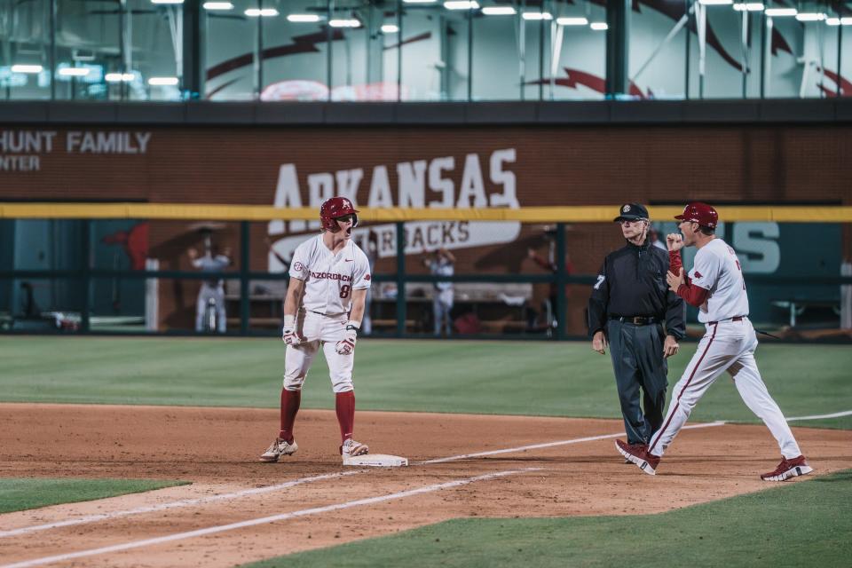 Arkansas baseball's Hudson White celebrates a two-run single that proved to be the game-winning hit in the Hogs' 7-5 victory over Mississippi State Friday, May 10, 2024.