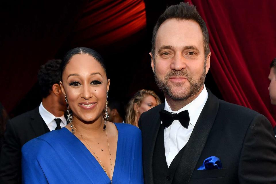 <p>Paras Griffin/Getty</p> Tamera Mowry (Left) and Adam Housley