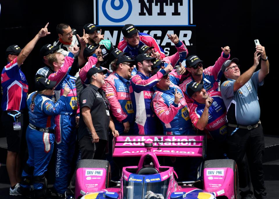 Andretti Autosport driver Alexander Rossi (27) celebrates with his team Saturday, July 30, 2022, after winning the Gallagher Grand Prix at Indianapolis Motor Speedway.