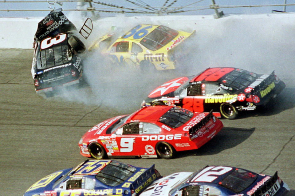 FILE - In this Feb. 18, 2001, file photo, Dale Earnhardt's (3) window pops out of the car after being hit by Ken Schrader (36) during the Daytona 500 auto race at Daytona International Speedway in Daytona Beach, Fla. NASCAR’s next 75 years almost certainly will include at least a partially electric vehicle turning laps at Daytona International Speedway. It’s unfathomable to some, unconscionable to others. (AP Photo/Greg Suvino, File)