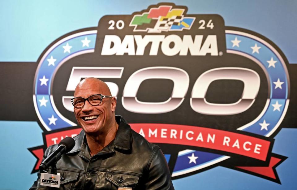 Dwayne “The Rock” Johnson speaks during a press conference at Daytona International Speedway on Sunday, March 18, 2024. Johnson will be the Grand Marshal for the Daytona 500. The race was postponed on Sunday until Monday, March 19, 2024 due to heavy rain. The Harley J. Earl trophy is given to the winner of the Daytona 500 race.