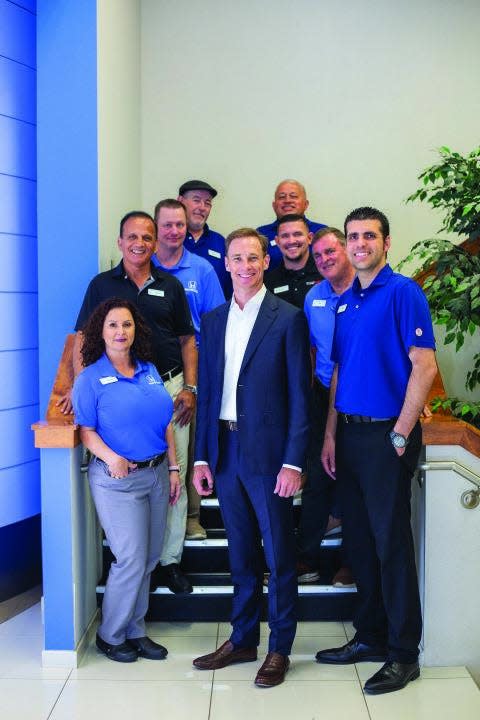 Michael Anderson, President and CEO of the family-owned Anderson Automotive Group, with the staff at Fred Anderson Honda.