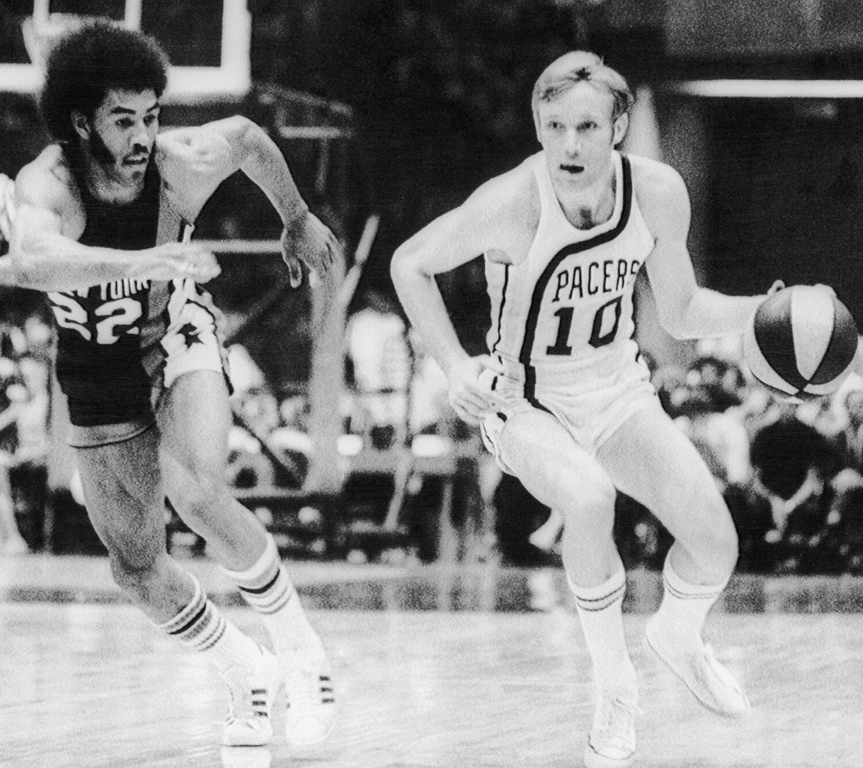 Ollie Taylor (22) of the New York Mets chases Indiana's Rick Mount (10) down court in an American Basketball Association (ABA) playoff game.