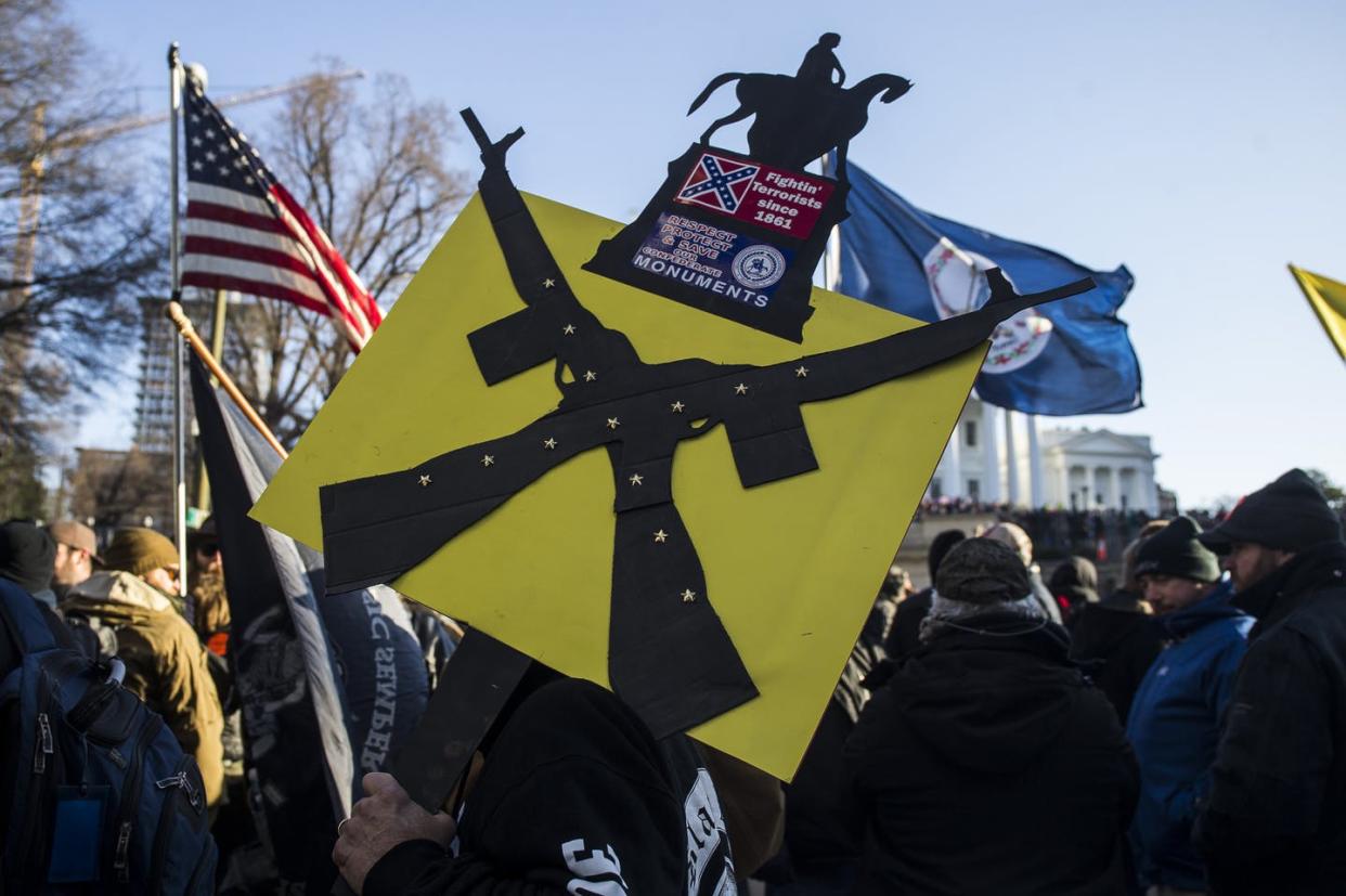 <span class="caption">Imagery and talk of guns can often be thinly veiled forms of threats.</span> <span class="attribution"><a class="link " href="https://www.gettyimages.com/detail/news-photo/gun-rights-advocates-attend-a-rally-organized-by-the-news-photo/1194885540" rel="nofollow noopener" target="_blank" data-ylk="slk:Zach Gibson/Getty Images;elm:context_link;itc:0;sec:content-canvas">Zach Gibson/Getty Images</a></span>