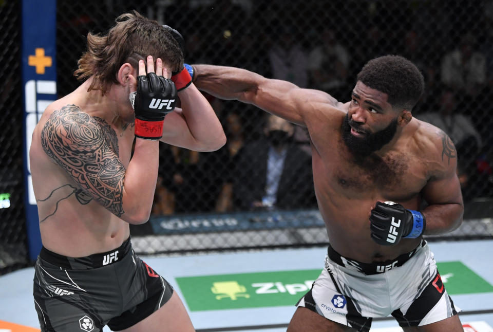 LAS VEGAS, NEVADA – DECEMBER 04: (R-L) Chris Curtis punches Brendan Allen in their middleweight fight during the UFC Fight Night event at UFC APEX on December 04, 2021 in Las Vegas, Nevada. (Photo by Jeff Bottari/Zuffa LLC)