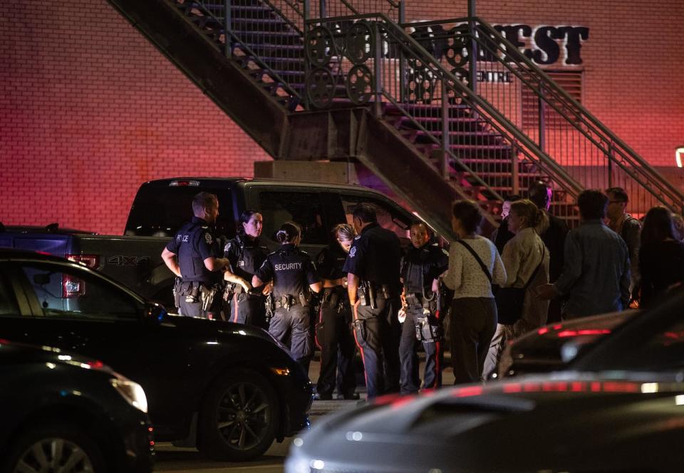 Officers at the scene of Monday's shooting at West Edmonton Mall. Police say three people were seriously injured. 