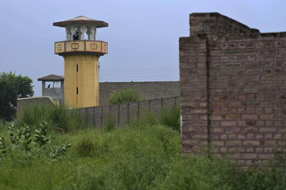 Police officers stand guard on the watch towers of district prison Attock, where Pakistan's former Prime Minister Imran Khan in-prison after his conviction, in Attock, Pakistan, Sunday, Aug. 6, 2023. Khan was arrested Saturday after a court handed him a three-year jail sentence for corruption, a development that could end his future in politics. (AP Photo/Anjum Naveed)