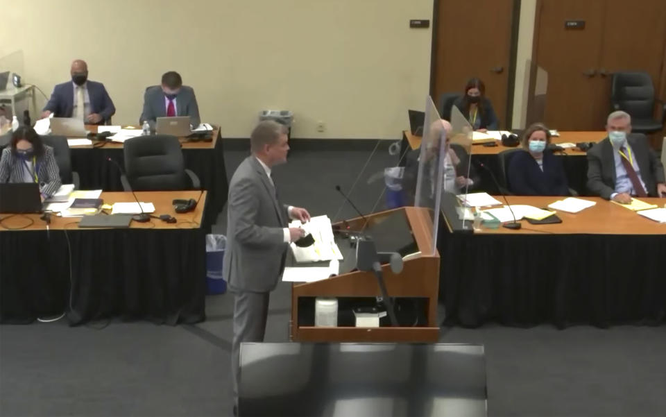 In this screen grab from video, Assistant Minnesota Attorney General Matthew Frank, center, questions a potential juror as Hennepin County Judge Regina Chu presides over jury selection Friday, Dec. 3, 2021, in the trial of former Brooklyn Center police Officer Kim Potter at the Hennepin County Courthouse in Minneapolis, Minn. Potter is charged with first- and second-degree manslaughter in the April 11 shooting of Wright, a 20-year-old Black motorist, following a traffic stop in the Minneapolis suburb of Brooklyn Center. (Court TV, via AP, Pool)