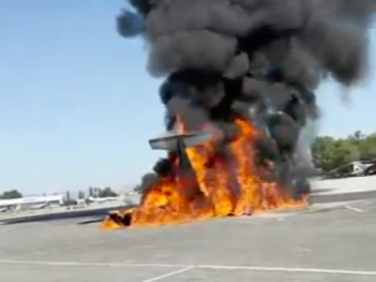 The wreckage of a small plane burns on a runway at Van Nuys Airport, in Los Angeles, California, on 2 August, 2023 (ABC 7)