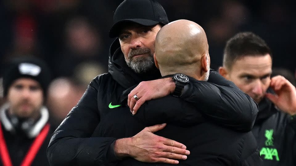 Jürgen Klopp and Pep Guardiola embraced after the 1-1 draw. - Paul Ellis/AFP/Getty Images