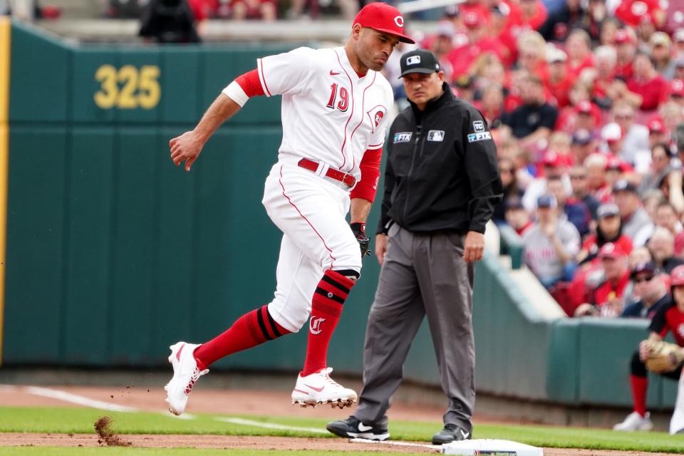 Cincinnati Reds first baseman Joey Votto (19) steps on first base for an out in the second inning during a baseball game against the Cleveland Guardians, Tuesday, April 12, 2022, at Great American Ball Park in Cincinnati, Ohio. 