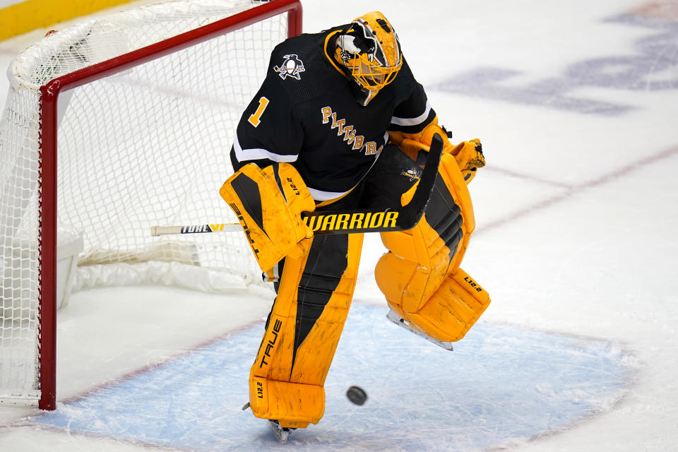 Pittsburgh Penguins goaltender Casey DeSmith celebrates his shutout of the Anaheim Ducks as time runs out in the third period of an NHL hockey game in Pittsburgh, Saturday, Dec. 11, 2021. The Penguins won 1-0. (AP Photo/Gene J. Puskar)