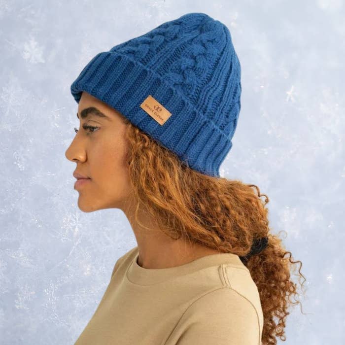 For a more textured look, this foldover beanie is the ultimate winter accessory. It features an interior satin lining Grace Eleyae is known for and adjustable drawstrings to secure a comfortable fit on your head. It comes in multiple colors, including blue, cream, black and wine red.You can buy the foldover beanie in all colors from Grace Eleyae for $46. 