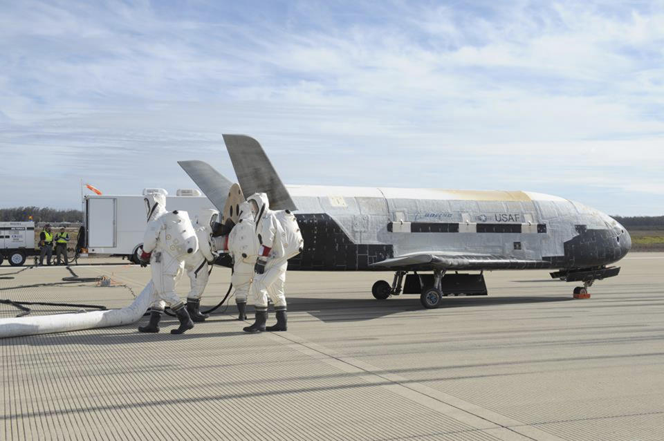 The X-37B Orbital Test Vehicle mission 3 space plane is shown after landing at Vandenberg Air Force Base, California October 17, 2014 in this handout photograph provided by Vandenberg Air Force Base. The United States military landed the robotic space plane in central California on Friday, ending a classified 22-month mission that marked the third in Earth orbit for the experimental program, the Air Force said. REUTERS/Boeing/Vandenberg Air Force Base/Handout via Reuters (UNITED STATES - Tags: SCIENCE TECHNOLOGY MILITARY) ATTENTION EDITORS - THIS PICTURE WAS PROVIDED BY A THIRD PARTY. REUTERS IS UNABLE TO INDEPENDENTLY VERIFY THE AUTHENTICITY, CONTENT, LOCATION OR DATE OF THIS IMAGE. FOR EDITORIAL USE ONLY. NOT FOR SALE FOR MARKETING OR ADVERTISING CAMPAIGNS. THIS PICTURE IS DISTRIBUTED EXACTLY AS RECEIVED BY REUTERS, AS A SERVICE TO CLIENTS