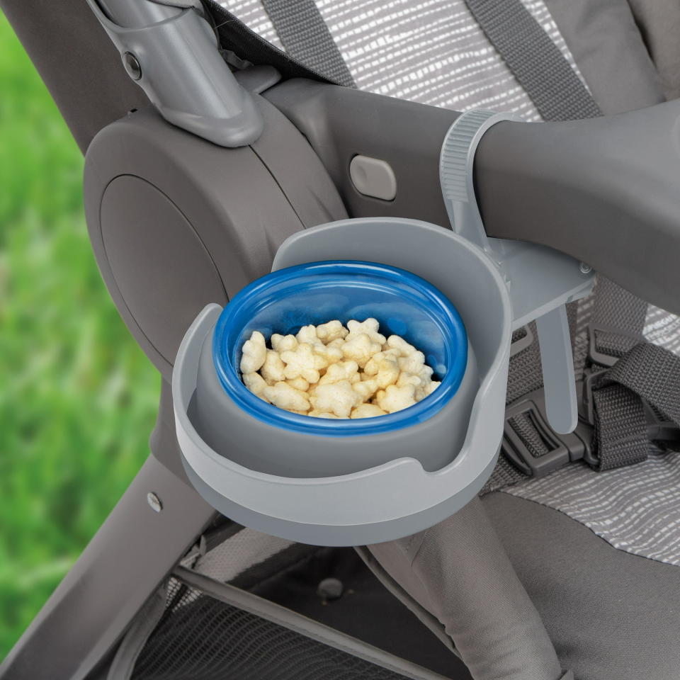 The cup holder holding a bowl of puffs