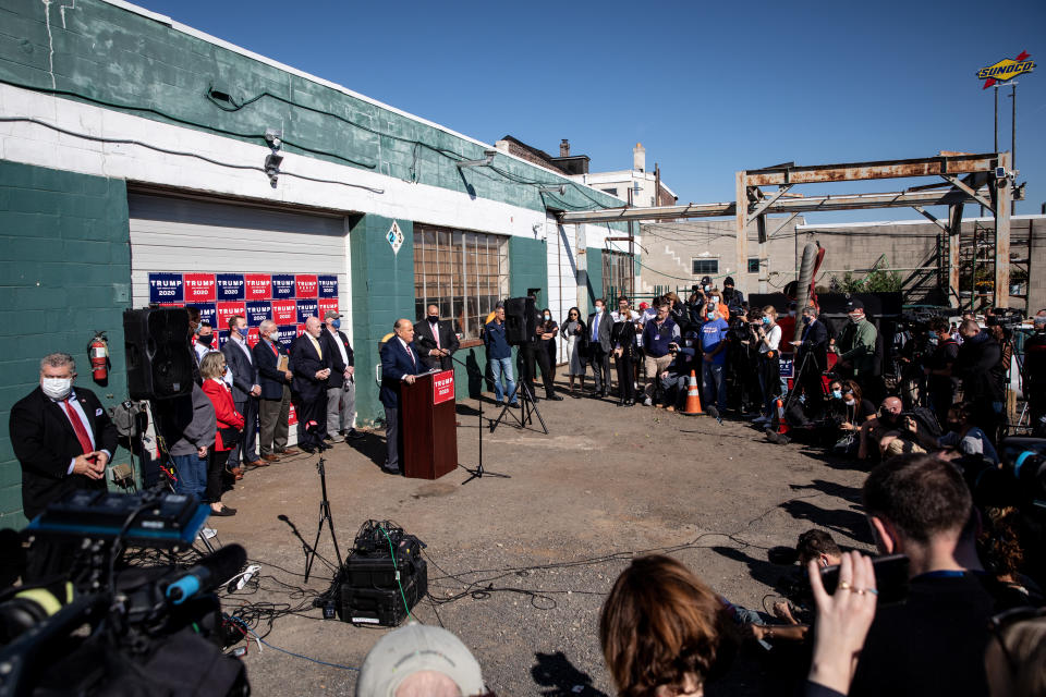 PHILADELPHIA, PENNSYLVANIA - NOVEMBER 07: Attorney for the President, Rudy Giuliani speaks to the media at a press conference held in the back parking lot of landscaping company on November 7, 2020 in Philadelphia, Pennsylvania. The press conference took place just minutes after news networks announced that Joe Biden had won the presidency over Donald Trump after it was projected that he had won the state of Pennsylvania. (Photo by Chris McGrath/Getty Images)