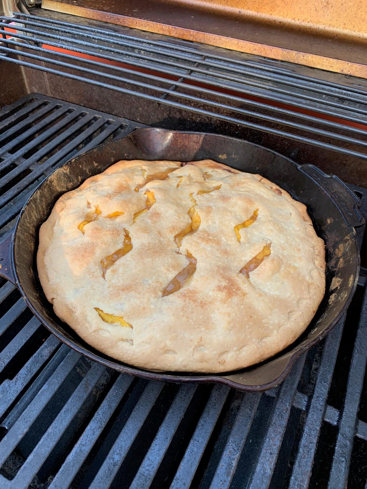 When it's too hot for the oven, peach pie baked on the grill is just perfection!