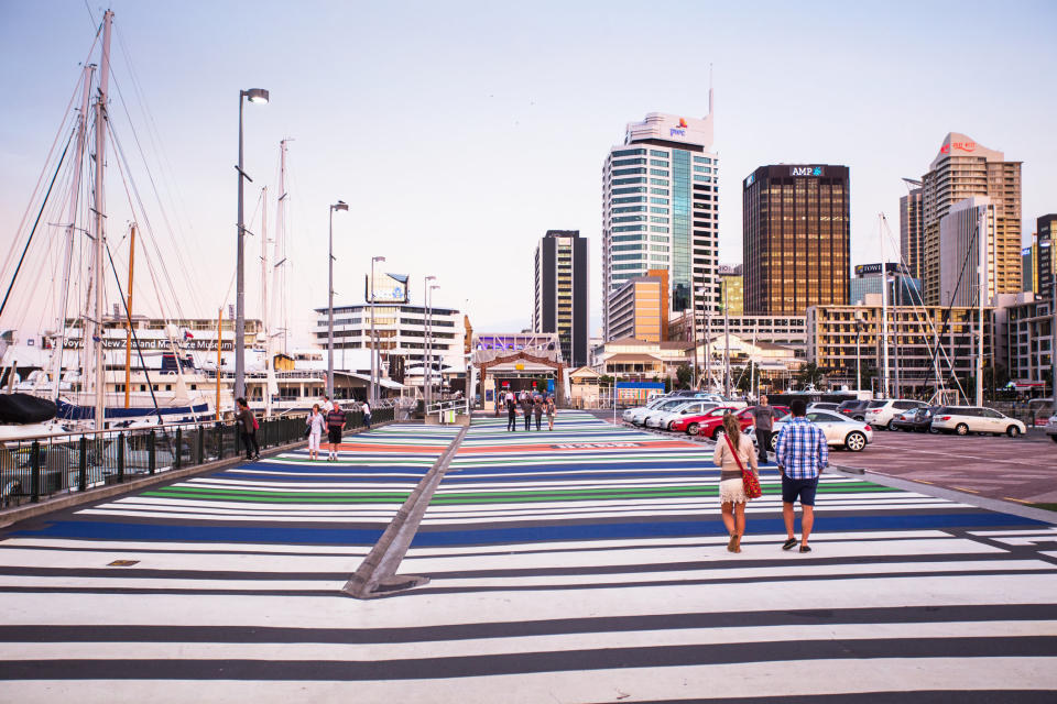 Residents walk along a boardwalk in Auckland, New Zealand, which received a livability score of&nbsp;95.7.