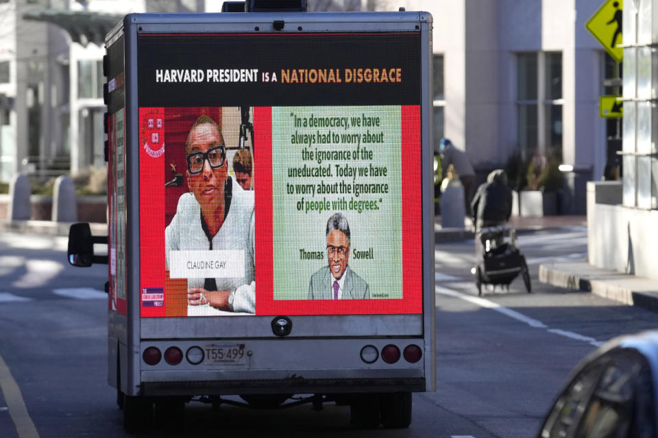 A truck with electronic panels drives along a street Tuesday, Dec. 12, 2023, near Harvard University, in Cambridge, Mass. The truck displays messages calling attention to a recent controversy involving testimony to Congress by presidents of three prestigious schools, including Harvard University, MIT, and the University of Pennsylvania. Harvard's highest governing body announced Tuesday that President Claudine Gay will remain leader of Harvard following her comments last week at a congressional hearing on antisemitism. (AP Photo/Steven Senne)