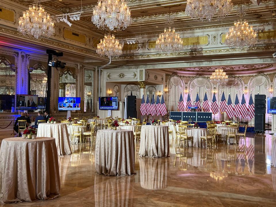 The Donald J. Ballroom at former President Donald Trump's Mar-a-Lago was decked out Tuesday night with a backdrop of U.S. flags.