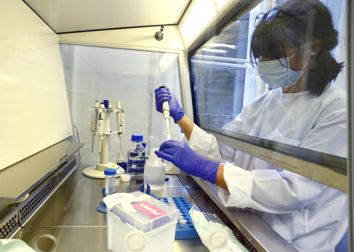 A laboratory technician is seen at the Inselspital Universitaetsspital Bern university hospital during researches for a vaccine against the coronavirus disease (COVID-19) in Bern, Switzerland April 22, 2020. (Arnd Wiegmann/Reuters)