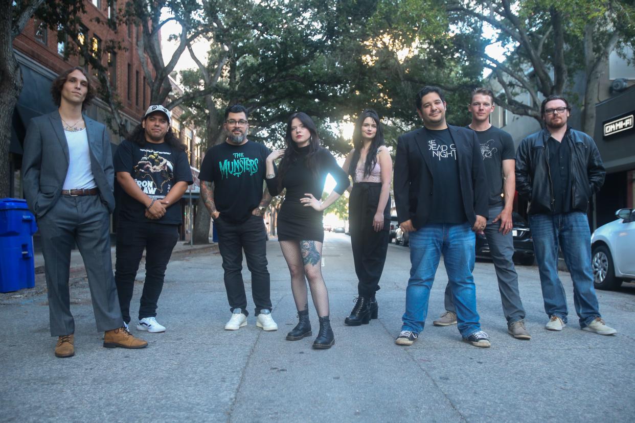 From left, directors Brady Bynum, Rene Guerrero, Gerald Flores, Emily Thyme, Jayda Rae Kolman, Jacob Grim, Mitchell Cummings and Jimmy Willden pose for a portrait outside of Produce Bar Co. on Peoples Street in downtown Corpus Christi Friday, Aug. 30, 2024. The eight are filmmakers for the horror anthology web series, "The Dead of Night."