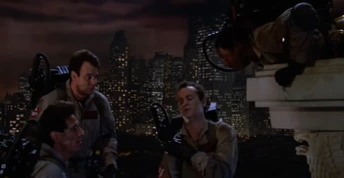 Winston talking to Ray atop a stone platform next to Venkman and Egon in "Ghostbusters"