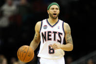 NEWARK, NJ - APRIL 10: Deron Williams #8 of the New Jersey Nets brings the ball up court in the second half against the Philadelphia 76ers at Prudential Center on April 10, 2012 in Newark, New Jersey. NOTE TO USER: User expressly acknowledges and agrees that, by downloading and or using this photograph, User is consenting to the terms and conditions of the Getty Images License Agreement. (Photo by Chris Chambers/Getty Images)