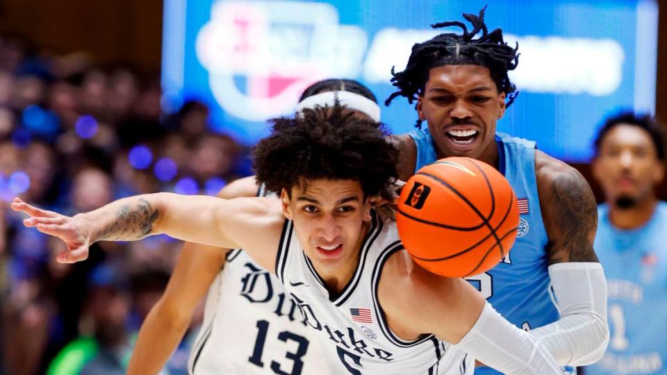 Duke’s Tyrese Proctor (5) and North Carolina’s Caleb Love (2) go after the ball during the first half of Duke’s game against UNC at Cameron Indoor Stadium in Durham, N.C., Saturday, Feb. 4, 2023.