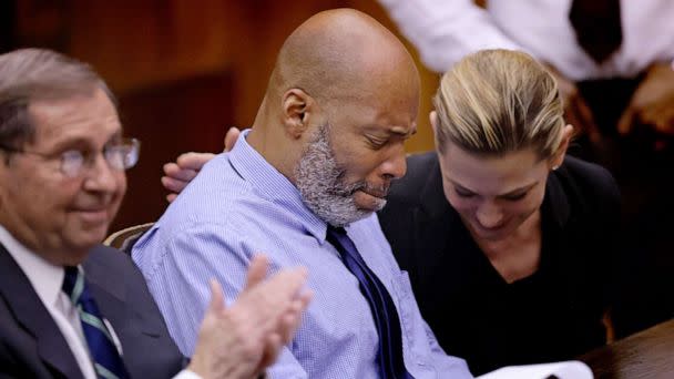 PHOTO: Lamar Johnson, center and his attorneys react, Feb. 14, 2023, after St. Louis Circuit Judge David Mason vacated his murder conviction during a hearing at Mel Carnahan Courthouse in St. Louis. (St. Louis Post-dispatch/TNS via Getty Images)