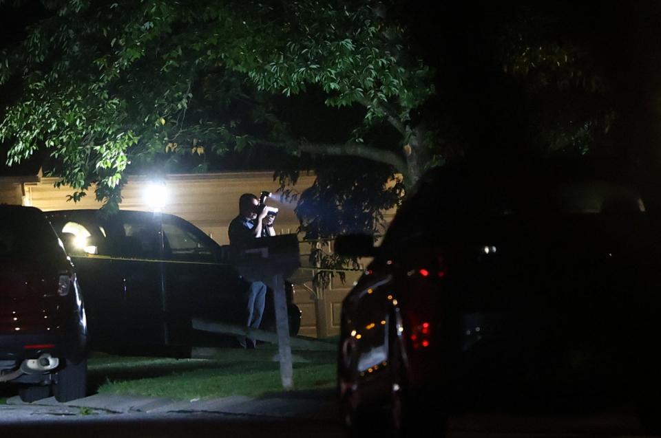 Police investigate after two people were killed and two others injured Monday evening in a reported stabbing in Hopewell Township.