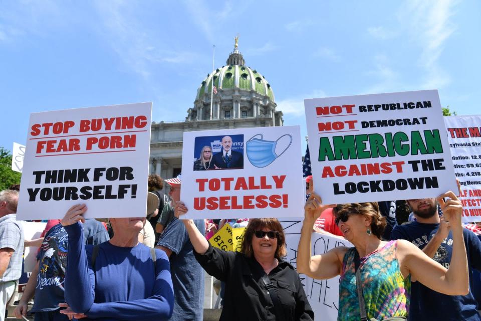 <span class="caption">The coronavirus pandemic has contributed to divisions rather than mitigated them, as shown here in a protest in Harrisburg, Pennsylvania, on May 15, 2020 in favor of reopening the state.</span> <span class="attribution"><a class="link " href="https://www.gettyimages.com/detail/news-photo/demonstrators-protest-in-harrisburg-pennsylvania-on-may-15-news-photo/1213147461?adppopup=true" rel="nofollow noopener" target="_blank" data-ylk="slk:Photo by Nicholas Kamm/AFP via Getty Images.;elm:context_link;itc:0;sec:content-canvas">Photo by Nicholas Kamm/AFP via Getty Images.</a></span>