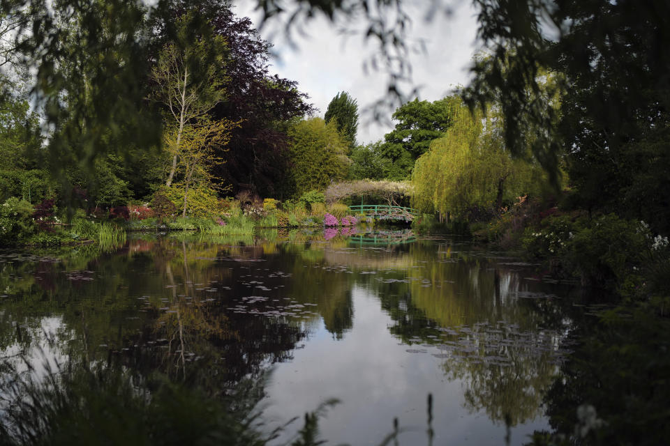 The Japanese-inspired water garden of Claude Monet's house, French impressionist painter who lived from 1883 to 1926, waits ahead of the re-opening, in Giverny, west of Paris, Monday May 17, 2021. Lucky visitors who'll be allowed back into Claude Monet's house and gardens for the first time in over six months from Wednesday will be treated to a riot of color, with tulips, peonies, forget-me-nots and an array of other flowers all competing for attention. (AP Photo/Francois Mori)