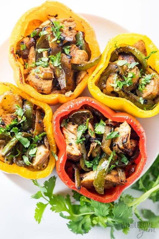 <p>Wholesome Yum</p><p>Chicken fajita stuffed peppers are a fun and easy twist on fajitas. </p><p><strong>Get the recipe: </strong><a href="https://www.wholesomeyum.com/whole30-stuffed-peppers-recipe/" rel="nofollow noopener" target="_blank" data-ylk="slk:Chicken Fajita Stuffed Peppers;elm:context_link;itc:0;sec:content-canvas" class="link "><strong>Chicken Fajita Stuffed Peppers</strong></a></p>