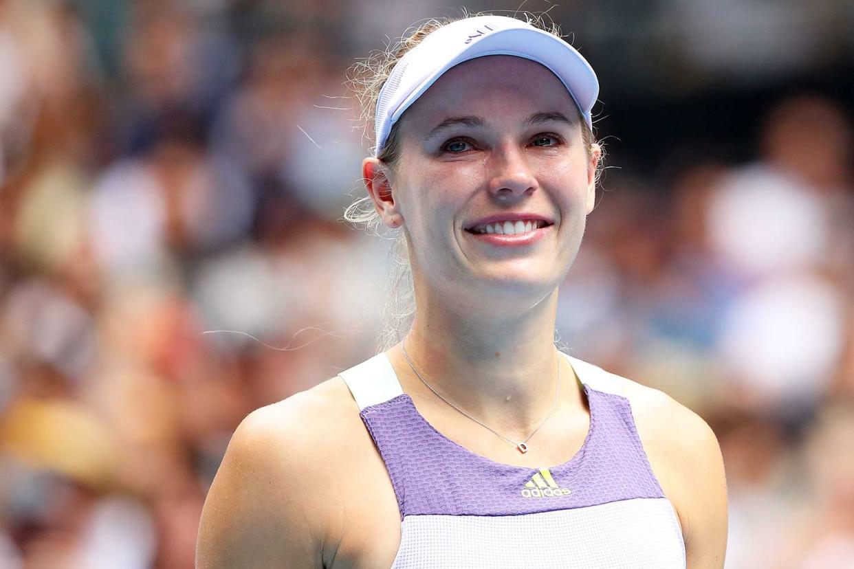 Caroline Wozniacki of Denmark acknowledges the crowd after losing her Women's Singles third round match against Ons Jabeur of Tunisia on day five of the 2020 Australian Open at Melbourne Park on January 24, 2020 in Melbourne