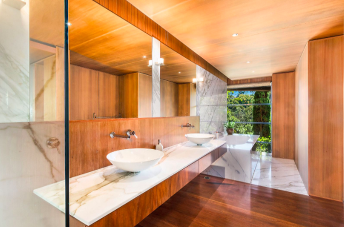 Bathroom features glossy timber finishes