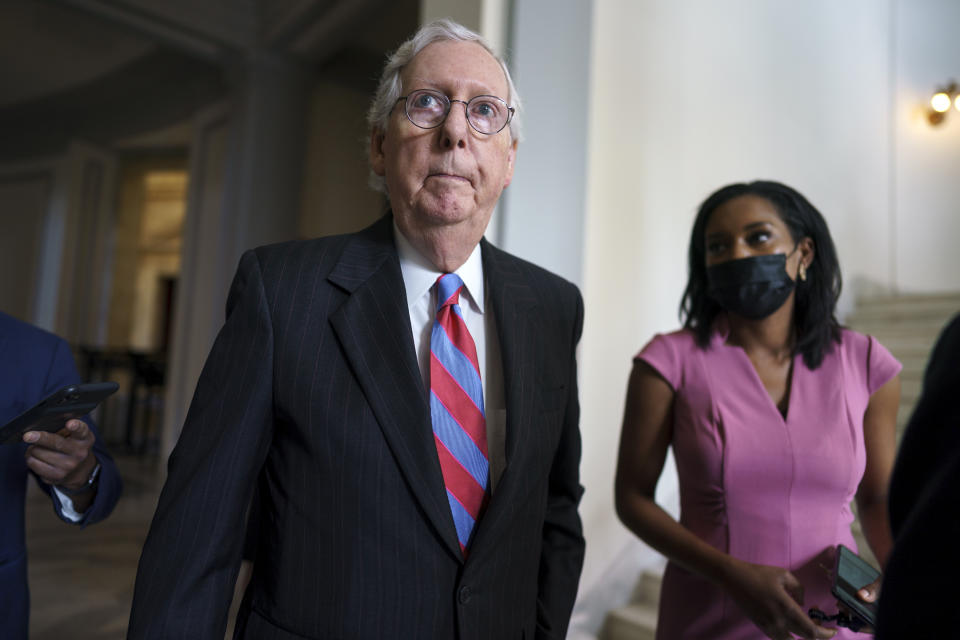 Senate Minority Leader Mitch McConnell, R-Ky., is flanked by reporters as he returns to the Senate chamber for a vote after attending a bipartisan barbecue luncheon, at the Capitol in Washington, Thursday, Sept. 23, 2021. (AP Photo/J. Scott Applewhite)